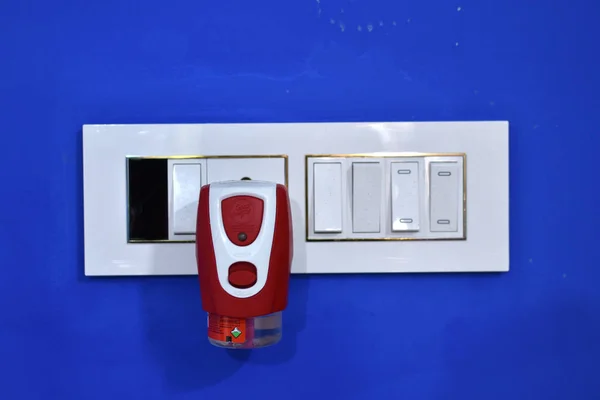 Electric anti mosquito fumigator plugging on the wall socket. Close up, selective focus. — Stock Photo, Image