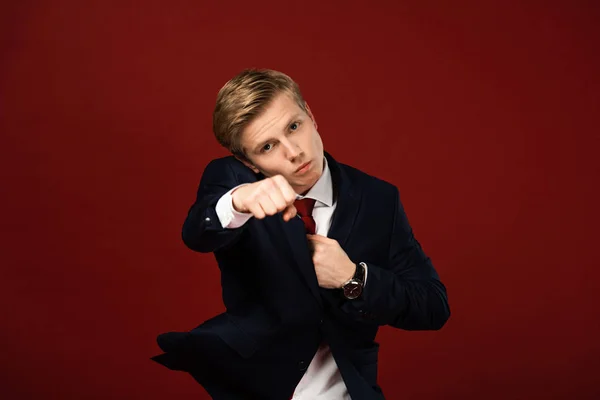 Confident Man Showing Fist Red Background — Stock Photo, Image