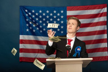 man throwing cash on tribune on american flag background clipart