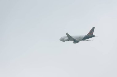 KYIV, UKRAINE - OCTOBER 21, 2019: Jet plane of brussels airlines taking off in cloudy sky clipart
