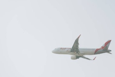 KYIV, UKRAINE - OCTOBER 21, 2019: Commercial plane of air arabia airline in cloudy sky clipart