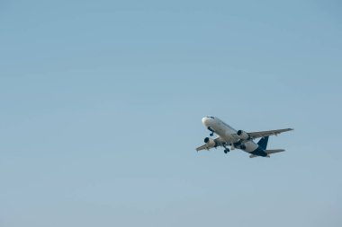 Flight departure of jet plane in clear sky clipart