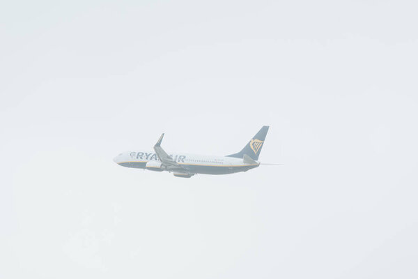 KYIV, UKRAINE - OCTOBER 21, 2019: Flight departure of ryanair airplane in cloudy sky