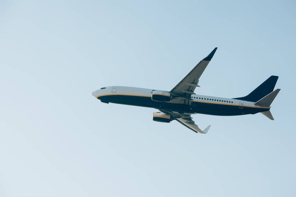 Low angle view of airplane departure in clear sky