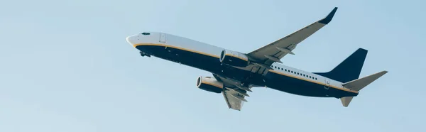 Panoramic shot of aeroplane with blue sky at background — Stock Photo