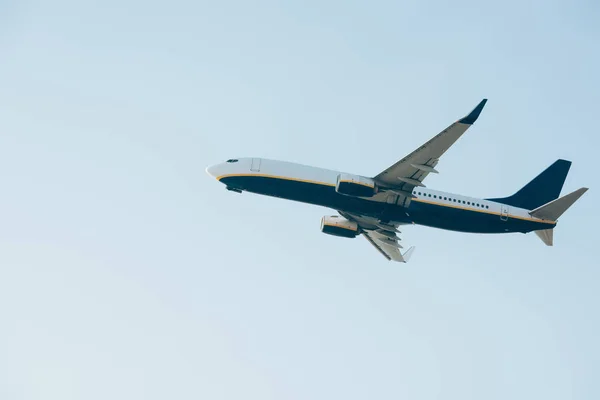 Low angle view of aeroplane with blue sky at background — Stock Photo