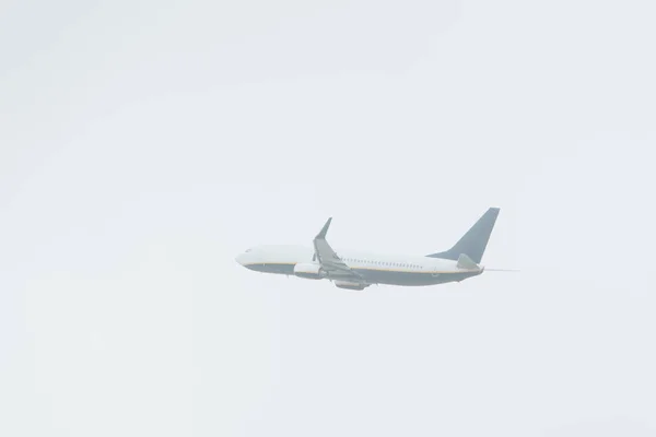 Low angle view of jet plane with cloudy sky at background — Stock Photo