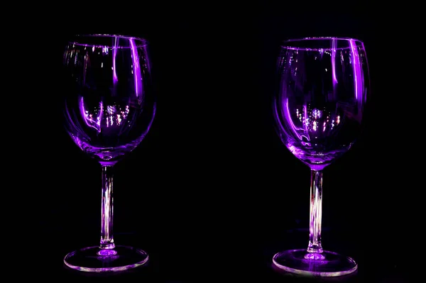 Colourful party in a restaurant wine glass light reflection with