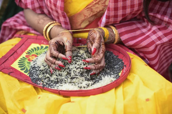 Closeup traditional view of bengali wedding rituals with rice an