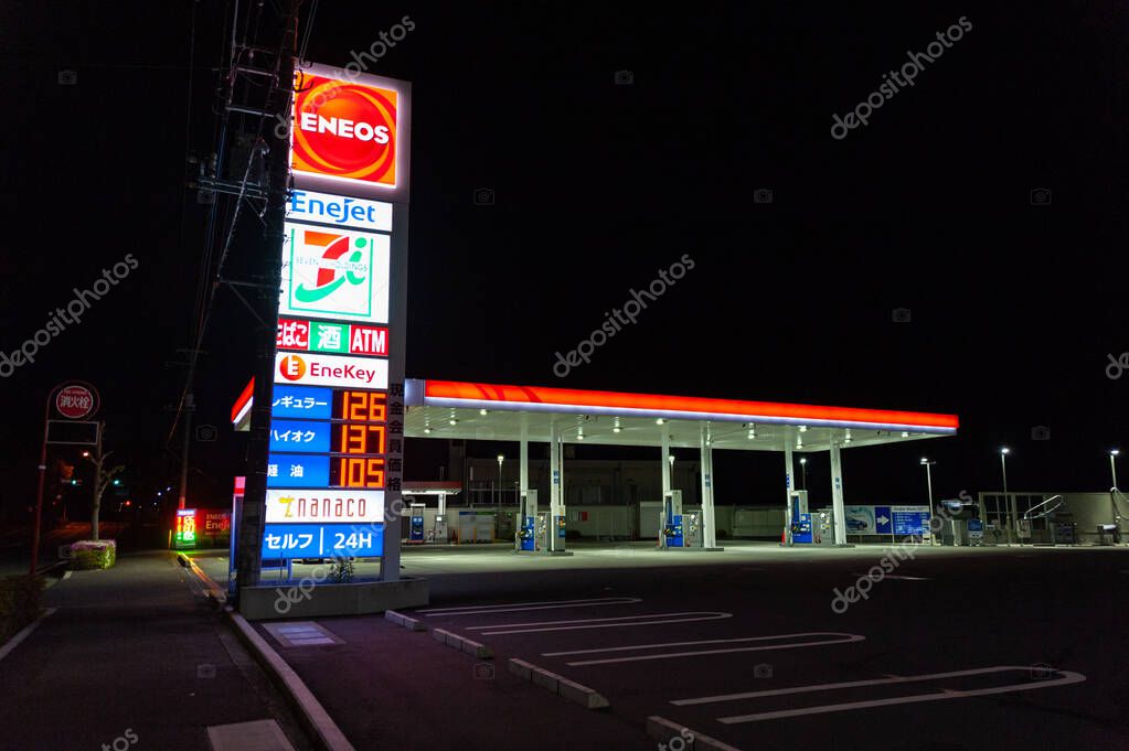 Fuji City, Shizuoka Prefecture, Japan - April 25, 2020: Self-service ENEOS gas station at night. Horizontal shot.