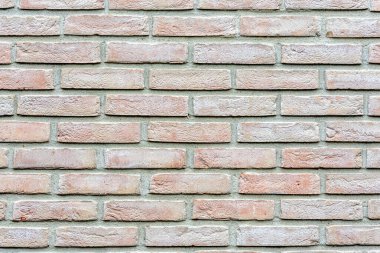 Eklemleri, yapısı ve farklı renkleri olan taş duvar.