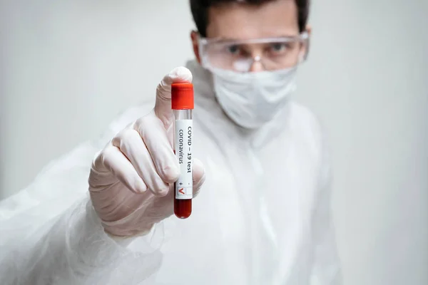 Scientist Protective Suit Mask Gloves Holding Positive Covid Test Sample — Stock Photo, Image