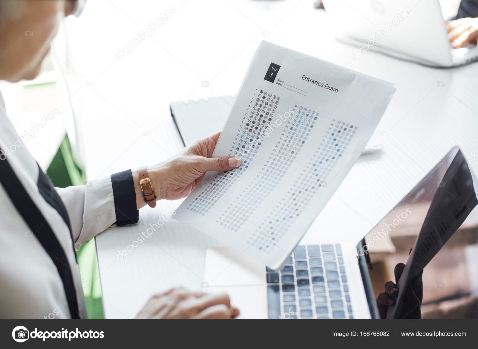 Teacher Grading Exam Papers Stock Photo luminastock Teacher Grading Exam Papers Stock Photo luminastock