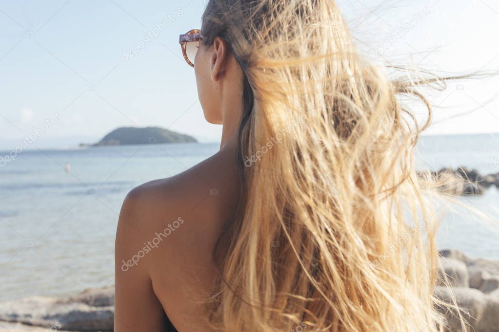 Woman Enjoying Sun and Sea