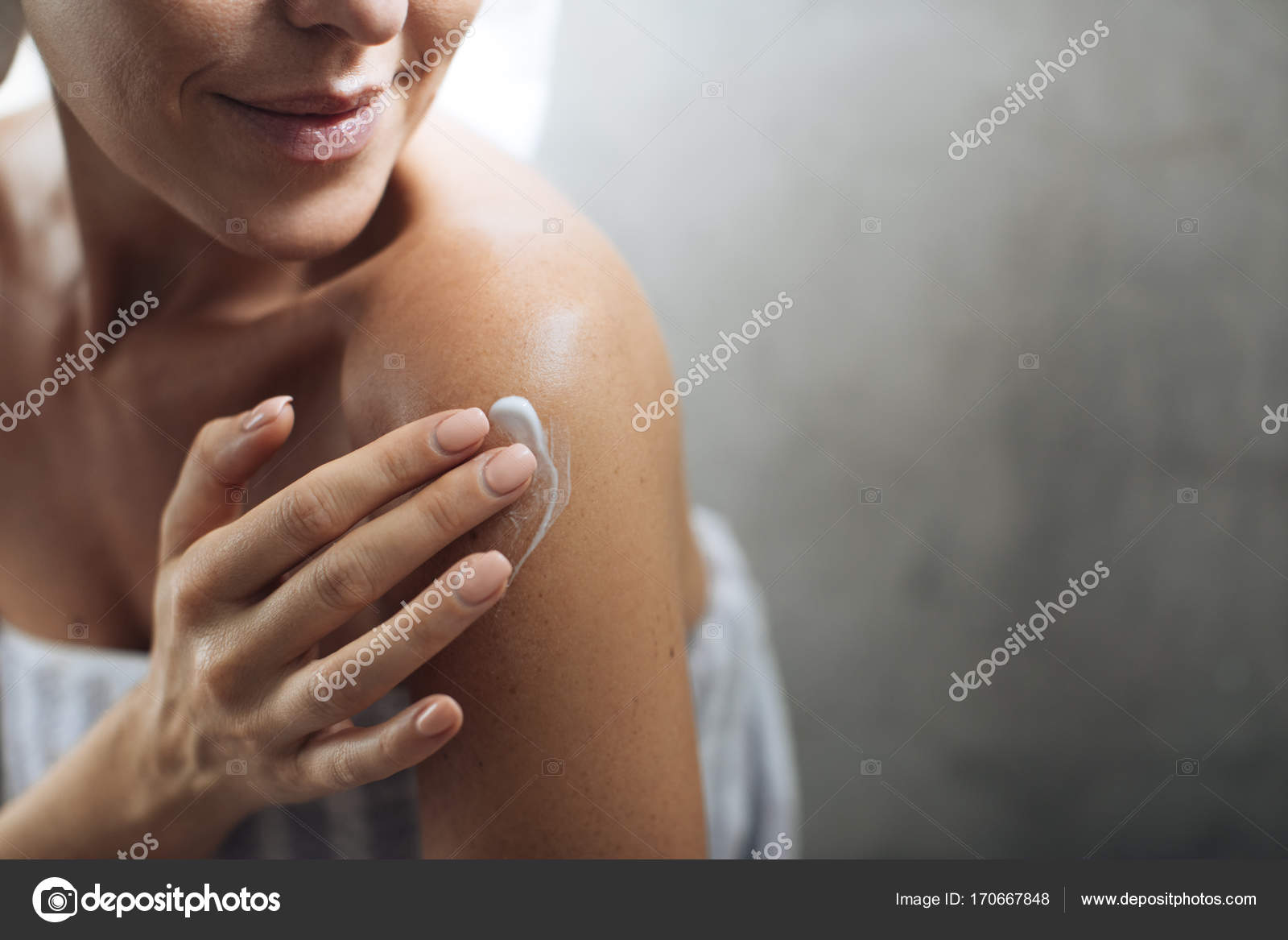 Woman Applying Moisturising Creme on Her Body Stock Photo by