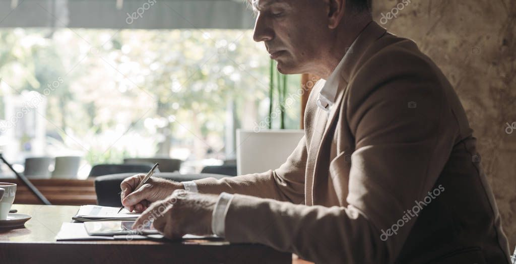 Elegant Businessman Writing