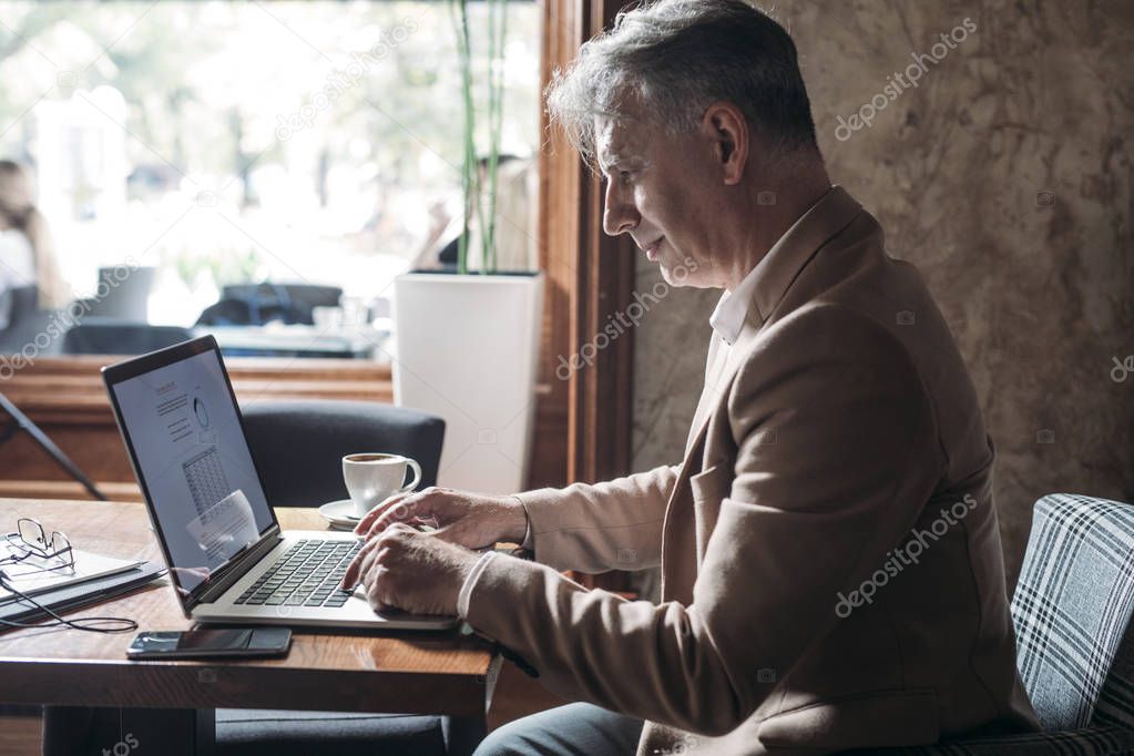 Businessman Typing on Laptop