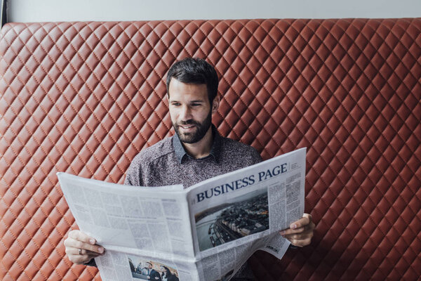 Man Reading Newspaper