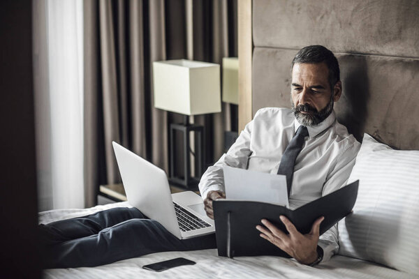 Businessman Working at Hotel Room