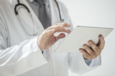 Doctor Holding Tablet