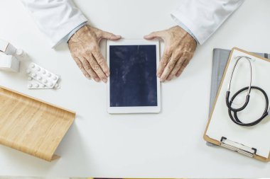 Doctor Holding Tablet