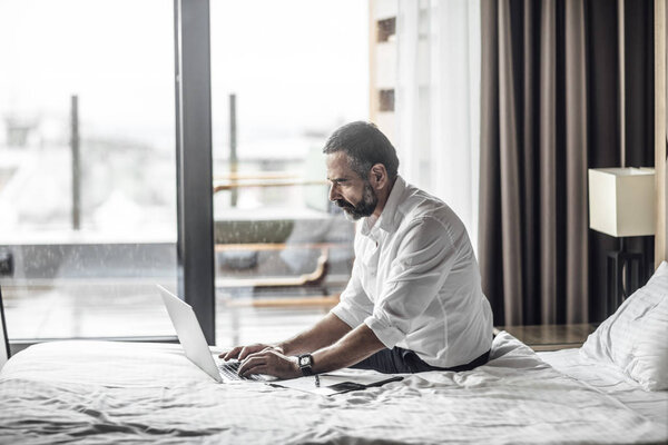 Businessman Typing on Laptop