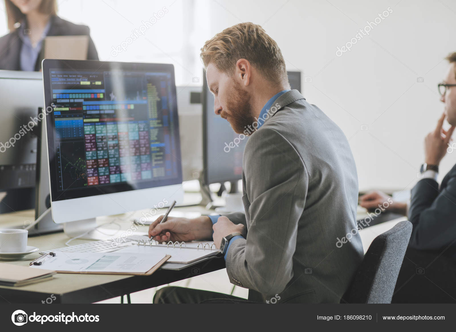 Stock Broker Working at Office Stock Photo by ©luminastock 186098210