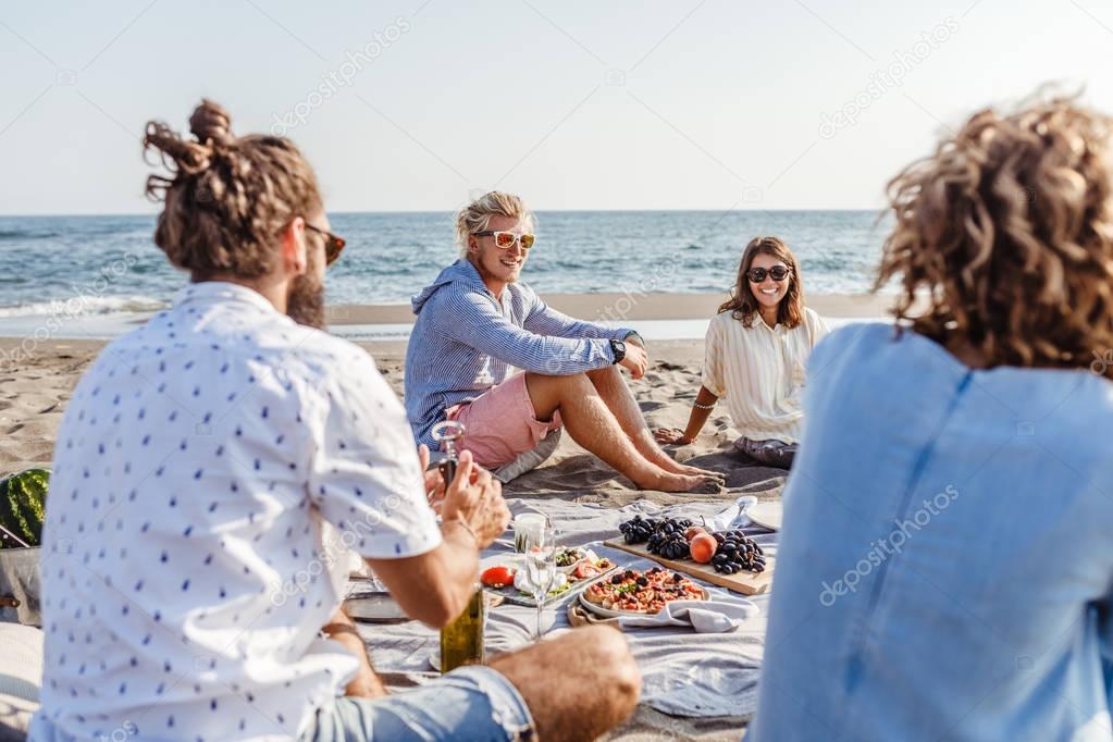 Friends Having Picnic on the Beach