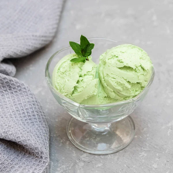 Green organic avocado ice cream on neutral background