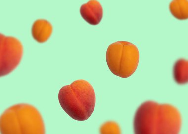 Arka planda farklı boyutlarda parlak yaz kayısıları uçuşuyor.