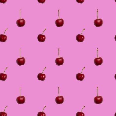 Pembe arka planda olgun kırmızı kirazsız desen