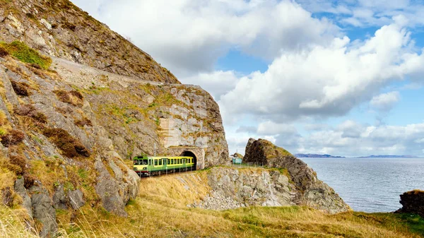 Train exiting a tunnel. View from Cliff Walk Bray to Greystones, Ireland