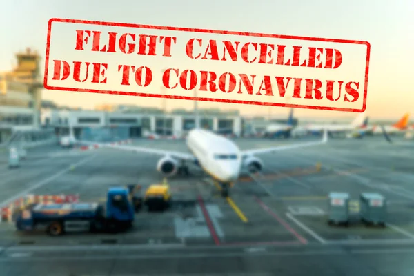 Flight cancelled. Defocused view of grounded passenger airplanes on empty and closed airfield or airport due to coronavirus or covid 19 pandemics