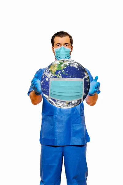 Male doctor in scrubs with face mask holding planet earth with protective face mask. Plain white background. Coronavirus concept, 3D illustration