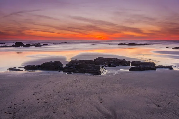 Red sunset at beach — Stock Photo, Image