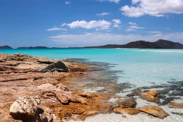 stock image Relaxing clear water beach with mountains in the background 3