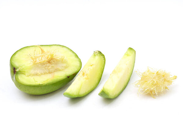    Kedondong also known as ambarella fruit or otaheite apple  on cutting board