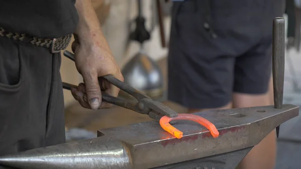 A blacksmith\'s workshop. Blacksmith forge horseshoe