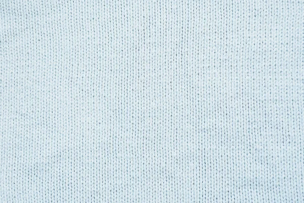 background and texture white knitted woolen fabric