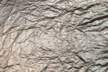 Kumaş dokusuna sahip buruşmuş gümüş arkaplan