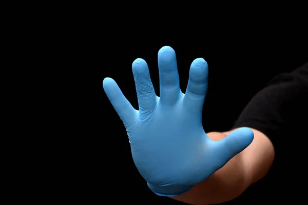 Hand Blue Medical Glove Extended Forward Photo Black Background — Stock Photo, Image