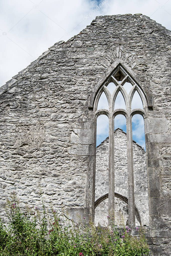 Stone wall of an old church ruin in Ireland