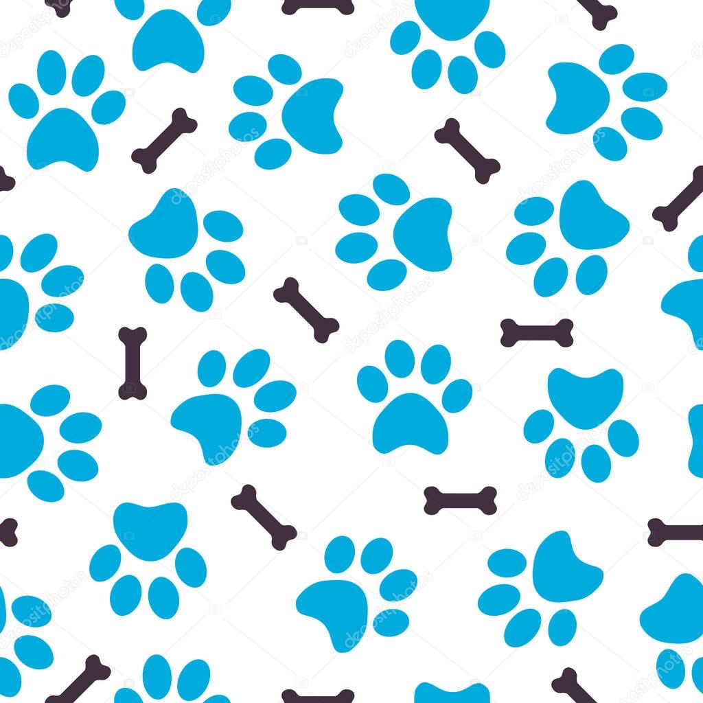 Seamless pattern of blue animal paws with bones