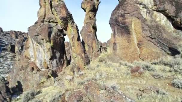 Bare Rock Pinnacle Rises Desert Canyon Floor — Stock Video