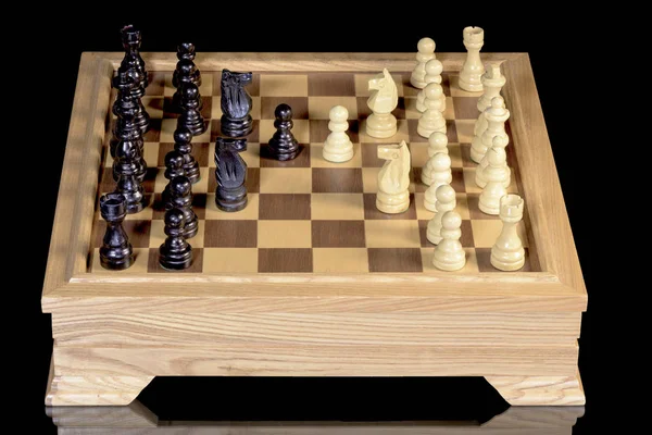 Black and white pieces on a chess board — Stock Photo, Image