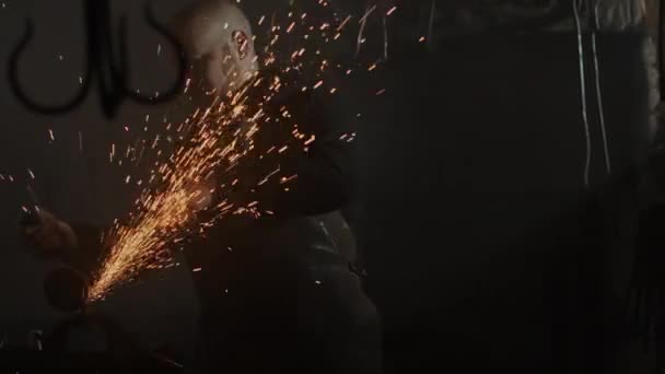 Blacksmith using angle grinder. Handheld slow motion in 4k . — Stock Video