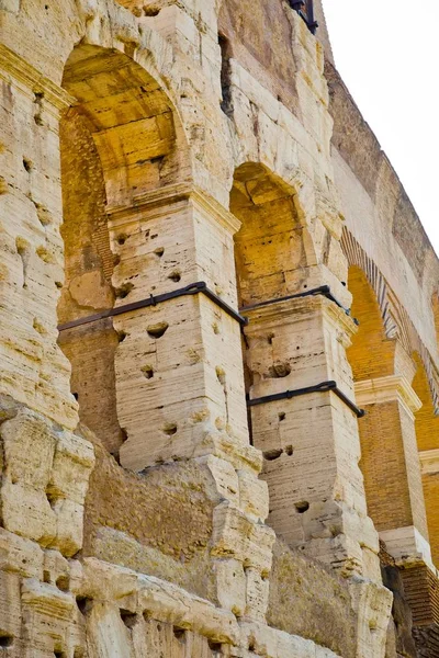 Steel bands on pillars to support stability of Colosseum in Rome