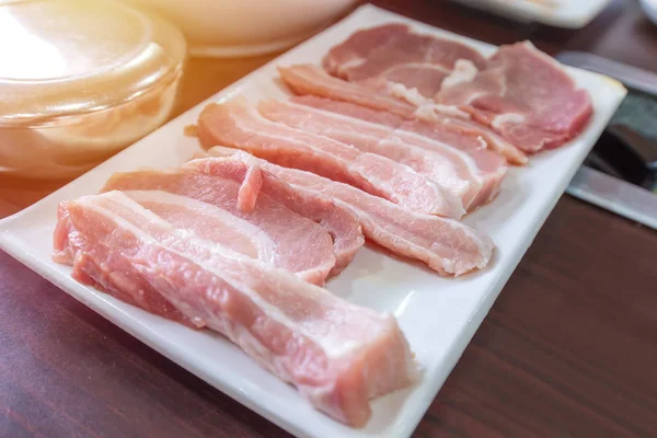 Raw pork belly meat slice on dish for barbecue — Stock Photo, Image