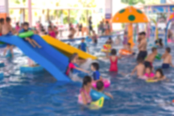 Blurred of Child having fun in swimming pool. Summer vacation an — Stock Photo, Image