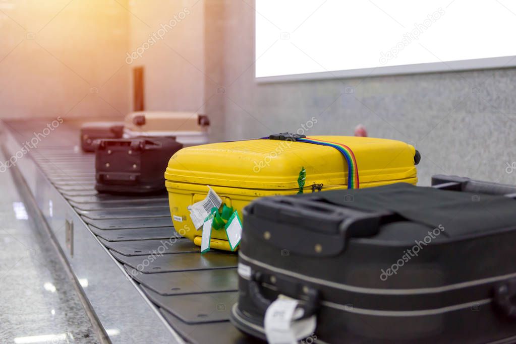 Suitcase or luggage with conveyor belt in the airport